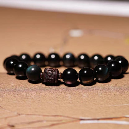 Pulsera curativa con personaje Om Mani Padme Hum Fu y obsidiana arcoíris con brillo dorado natural de Mythstone 