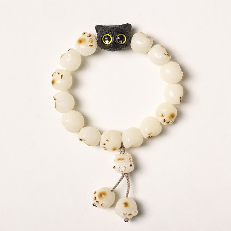 Pulsera de la suerte con forma de gato de la sabiduría y semillas de Bodhi naturales de Mythstone con forma de pata encantadora de madera de ébano 