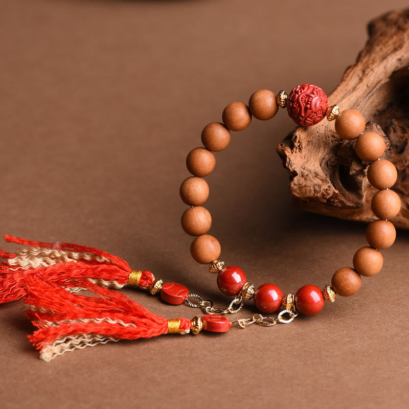 Pulsera de borlas de riqueza PiXiu con cinabrio de madera de melocotón natural tibetano Mythstone 