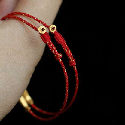 Pulsera trenzada de la suerte y la riqueza con pez koi bañada en oro de 14 quilates de Mythstone