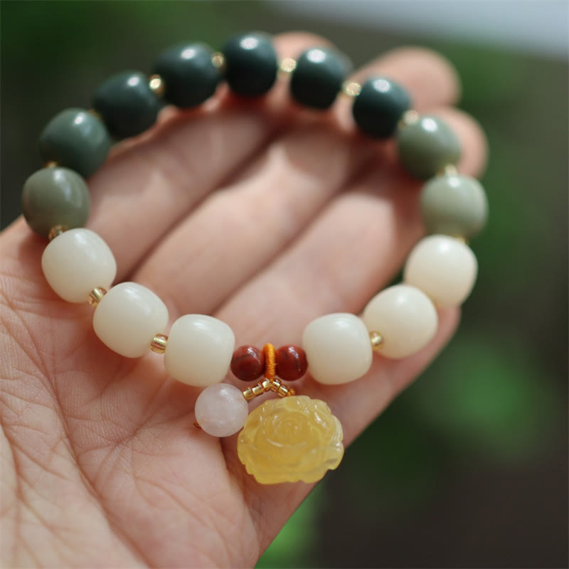 Pulsera de ámbar con semillas de bodhi y loto de la paz con degradado Mythstone