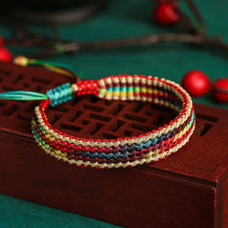 Pulsera trenzada de protección multicolor hecha a mano con piedra mítica del Tíbet