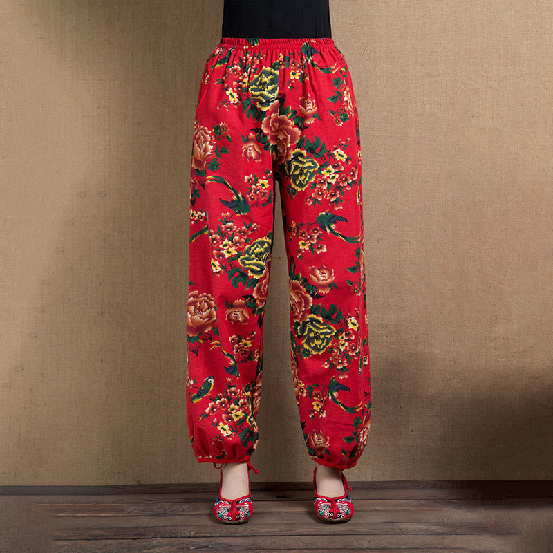 Pantalones harén con estampado de flores rojas y verdes de estilo étnico Mythstone y bolsillos 