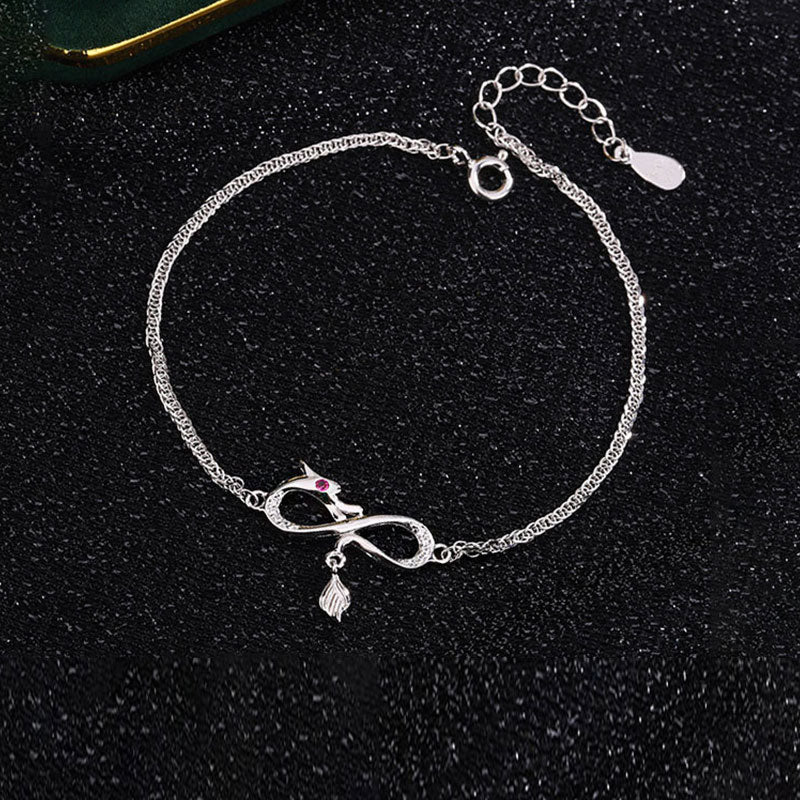 Pulsera de plata de ley 999 con amuleto de cola de nudo infinito y circonitas del año del dragón de Mythstone 