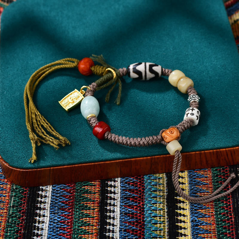 Pulsera de cuerda de la riqueza con cuentas tibetanas Dzi y hueso de yak de ágata