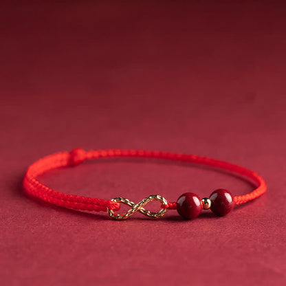 Pulsera tobillera con símbolo del infinito en oro de 14 quilates y hilo rojo con bendición de cinabrio de MythStone