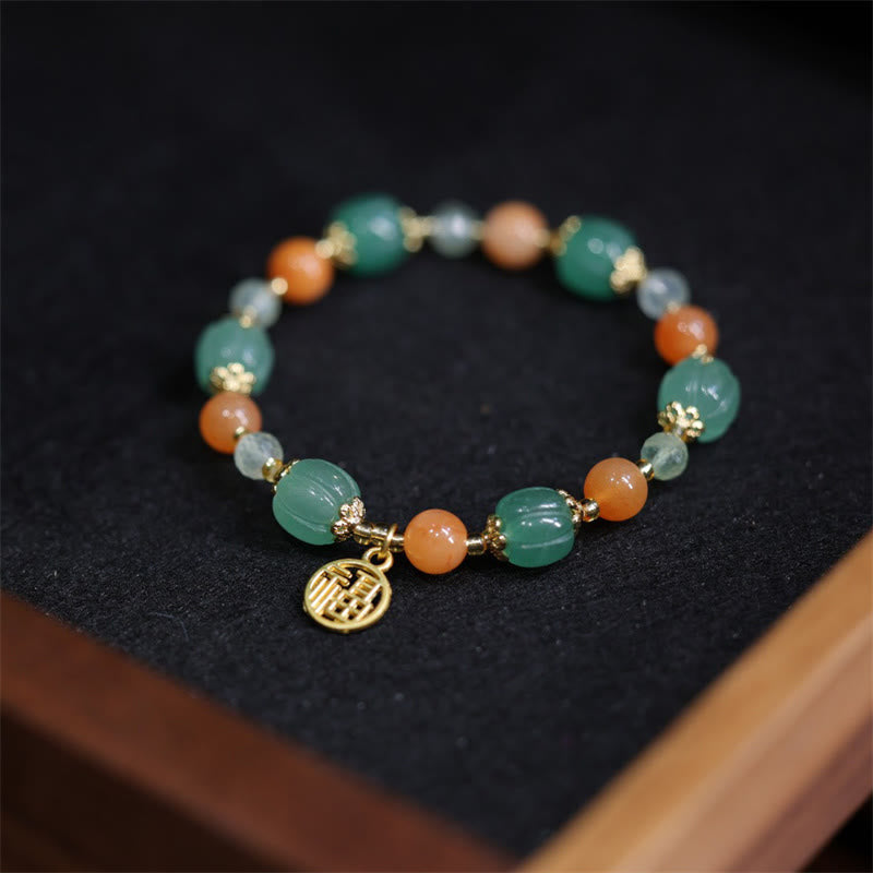 Pulsera de la riqueza con abalorios de calabaza de jade y seda dorada natural de Mythstone 