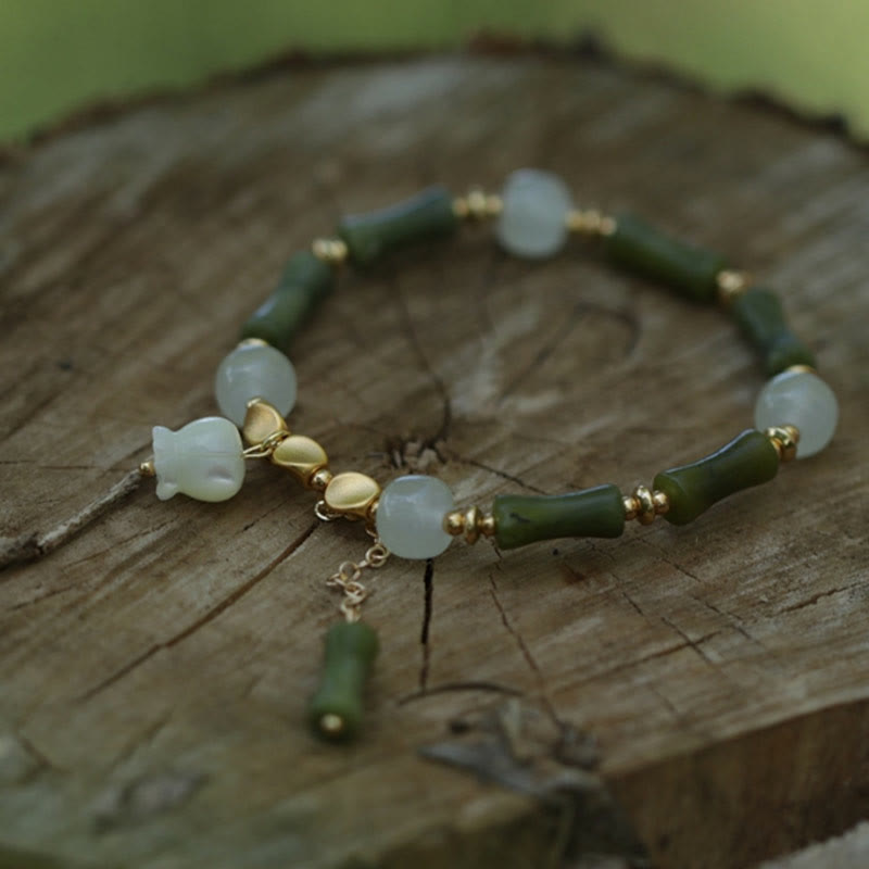 Pulsera de riqueza con lirio de los valles y jade de bambú verde Mythstone