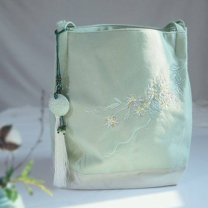 Bolso de mano de lona de gran capacidad con bordado de flores de ciruelo y grulla de Mythstone