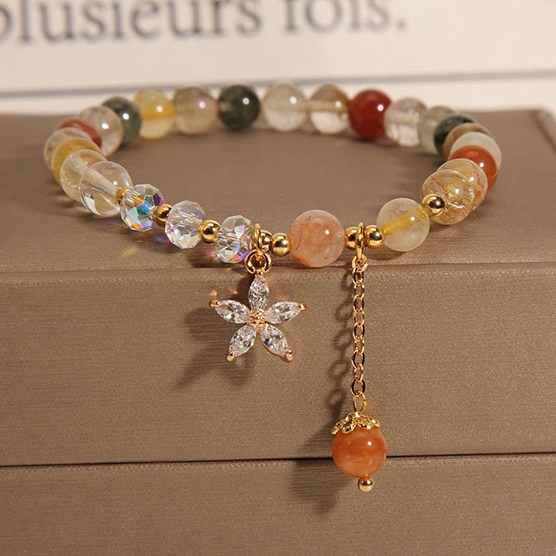 Pulsera de cuarzo rutilado multicolor con circonitas auspiciosas y flor de Mythstone