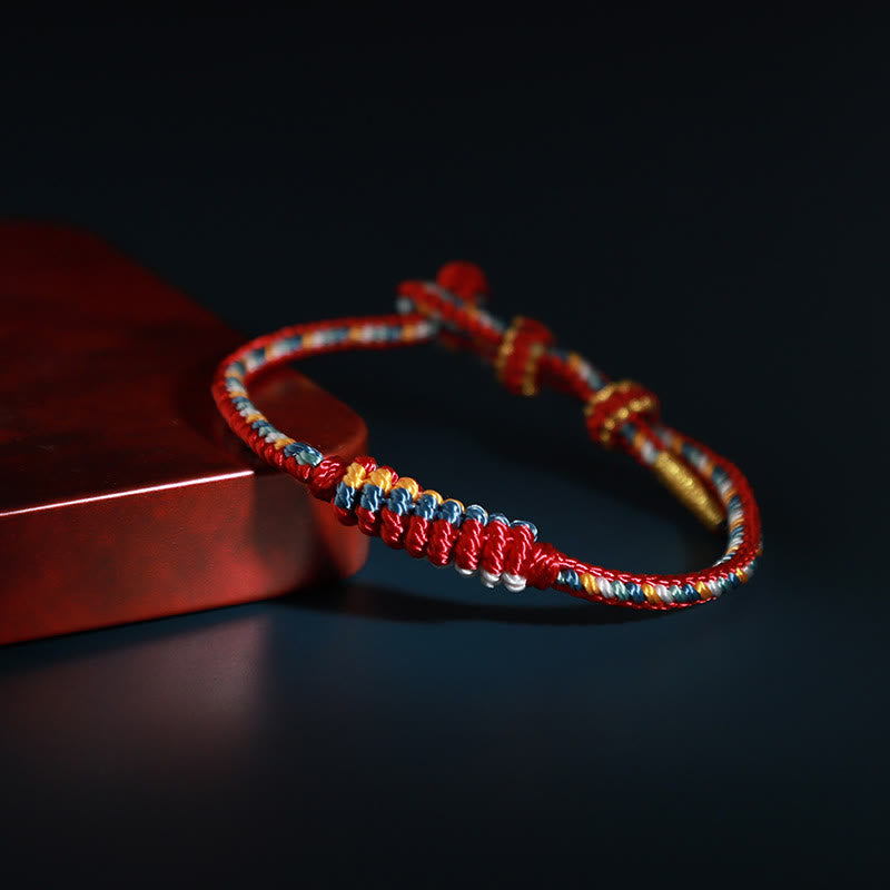 Pulsera trenzada de protección con forma de rueda de oración con nudo de la paz de ocho hilos hecha a mano tibetana Mythstone 