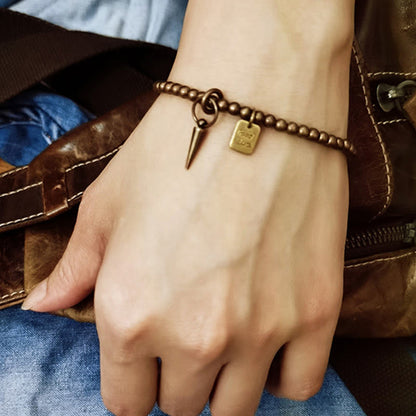 Pulsera de equilibrio de la fortuna con cuentas de latón y cobre vintage de Mythstone