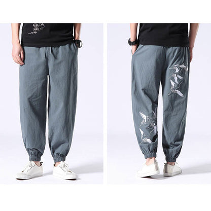 Pantalones harén con cordón y bolsillos para hombre con diseño bordado de grulla blanca de Mythstone 