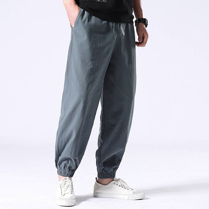 Pantalones harén con cordón y bolsillos para hombre con diseño bordado de grulla blanca de Mythstone 