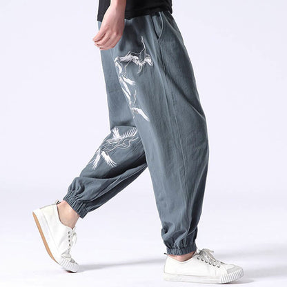 Pantalones harén con cordón y bolsillos para hombre con diseño bordado de grulla blanca de Mythstone 