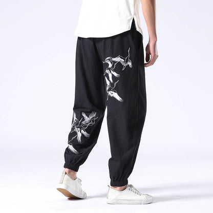 Pantalones harén con cordón y bolsillos para hombre con diseño bordado de grulla blanca de Mythstone 