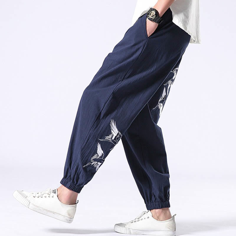 Pantalones harén con cordón y bolsillos para hombre con diseño bordado de grulla blanca de Mythstone 