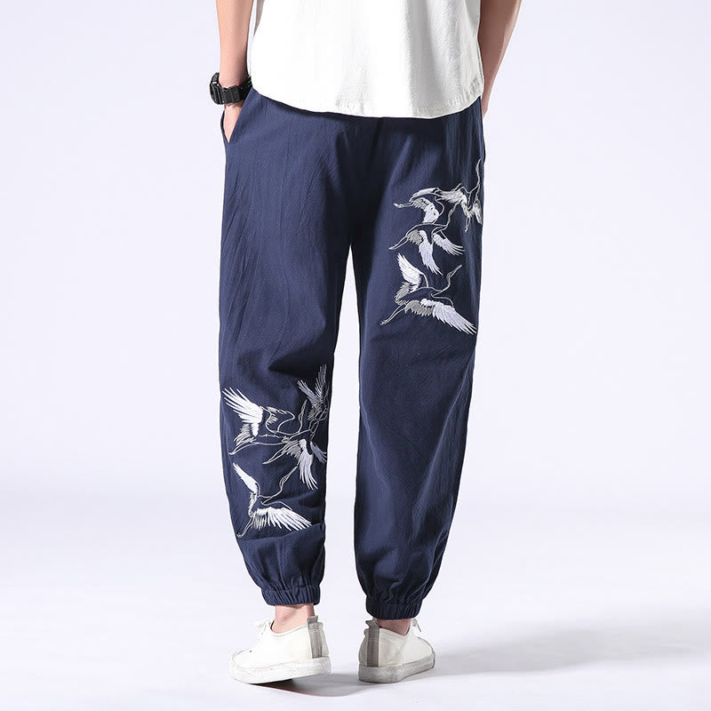 Pantalones harén con cordón y bolsillos para hombre con diseño bordado de grulla blanca de Mythstone 