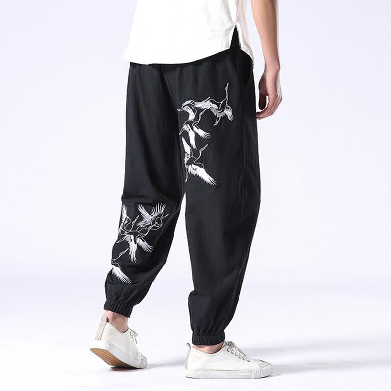 Pantalones harén con cordón y bolsillos para hombre con diseño bordado de grulla blanca de Mythstone 