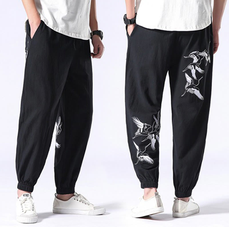 Pantalones harén con cordón y bolsillos para hombre con diseño bordado de grulla blanca de Mythstone 