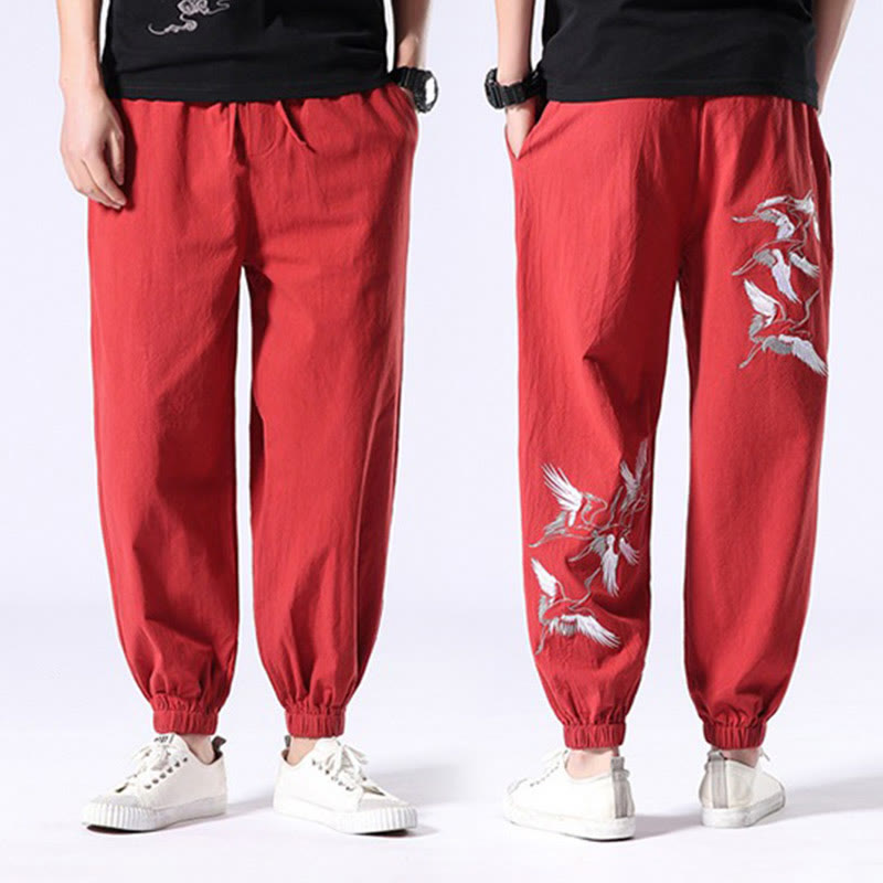 Pantalones harén con cordón y bolsillos para hombre con diseño bordado de grulla blanca de Mythstone 