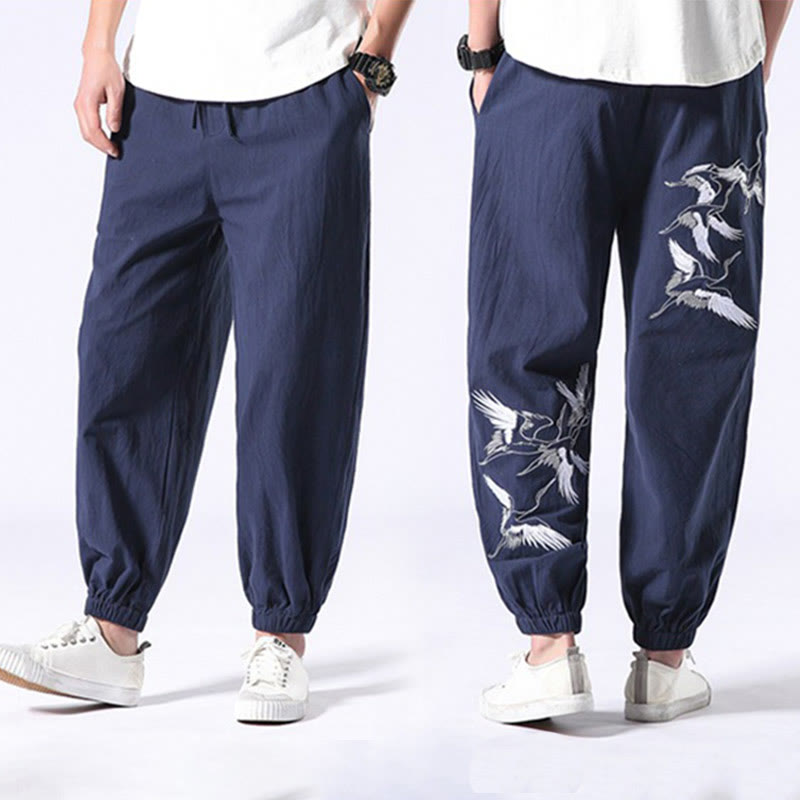 Pantalones harén con cordón y bolsillos para hombre con diseño bordado de grulla blanca de Mythstone 