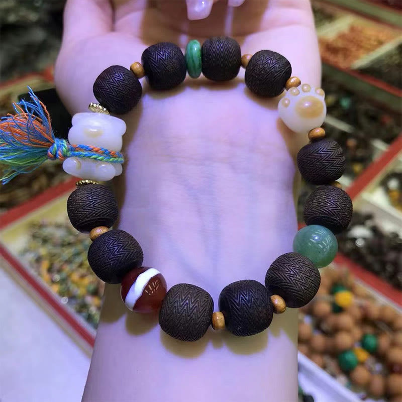 Pulsera de la paz con garra de gato y semilla de Bodhi de madera de agar Qinan verde Mythstone