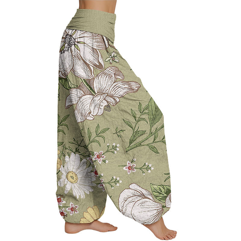 Pantalones harén con cintura elástica para mujer con estampado de flores blancas de margaritas de Mythstone 