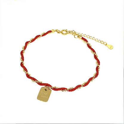 Pulsera de cobre bañada en oro con hilo rojo Mythstone que representa la buena suerte y la fuerza 