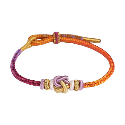 Pulsera trenzada protectora con nudo en forma de corazón y cordón colorido Mythstone 