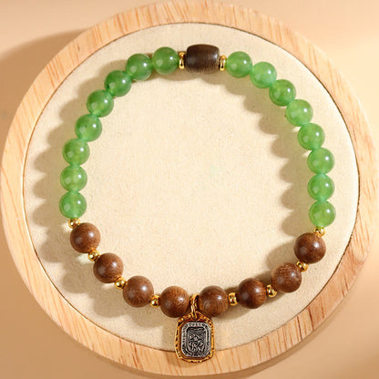 Pulsera de la diosa de la riqueza y la fuerza de la calcedonia verde de Kalimantan con piedra mitológica y madera de agar 