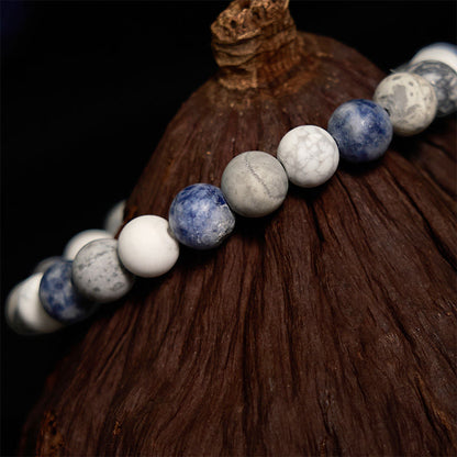 Pulsera relajante de jaspe Picasso, turquesa blanca y jaspe con puntos azules Mythstone 