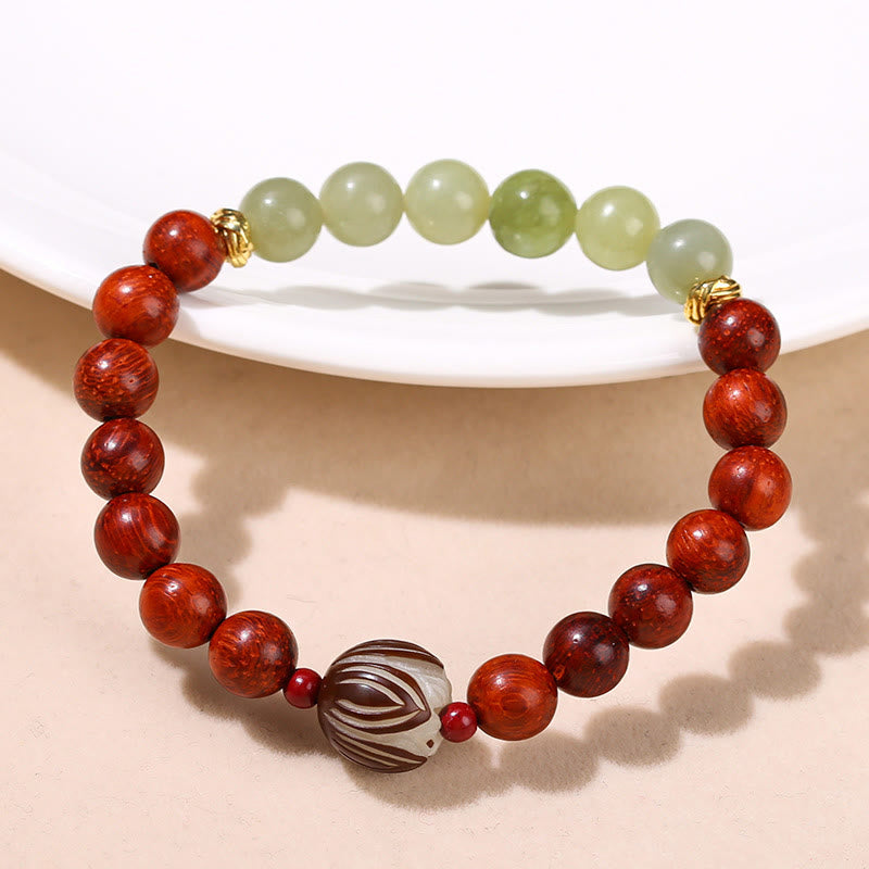 Pulsera de piedra de loto con semillas de bodhi, jade cian y palo de rosa natural que aporta calidez y calma