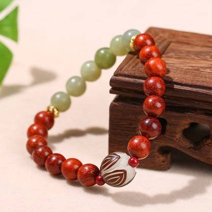 Pulsera de piedra de loto con semillas de bodhi, jade cian y palo de rosa natural que aporta calidez y calma