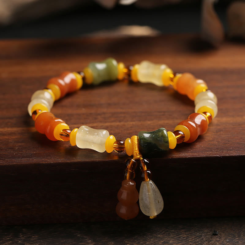 Pulsera con dije de riqueza de calabaza de jade de seda dorada natural Mythstone 