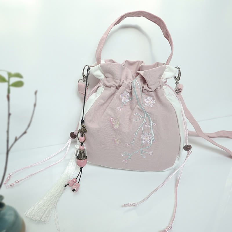 Bolso de mano de lona con flores bordadas a mano de Mythstone