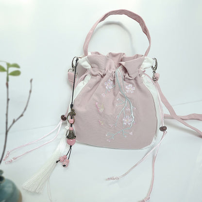 Bolso de mano de lona con flores bordadas a mano de Mythstone