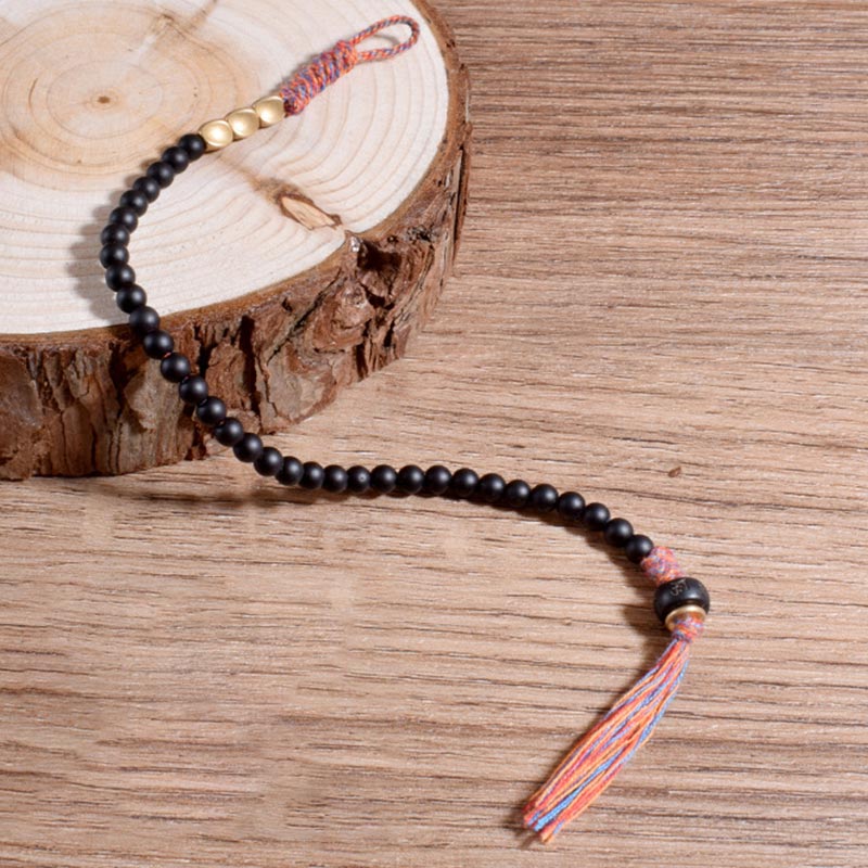 Pulsera de borlas de ónix negro tibetano hecha a mano Mythstone 