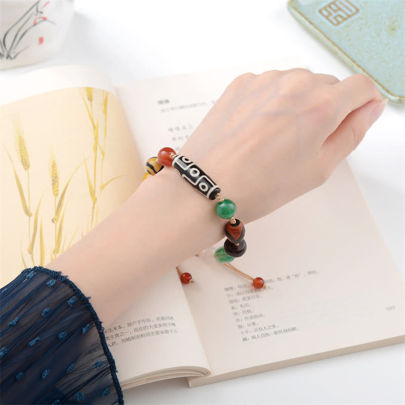 Pulsera de protección de riqueza de ágata con cuentas Dzi tibetanas de nueve ojos Mythstone 