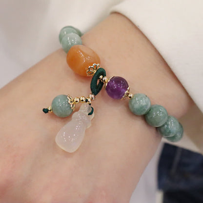 Pulsera curativa de cristal de amatista con hebilla de paz y loto de jade cian y calabaza Mythstone