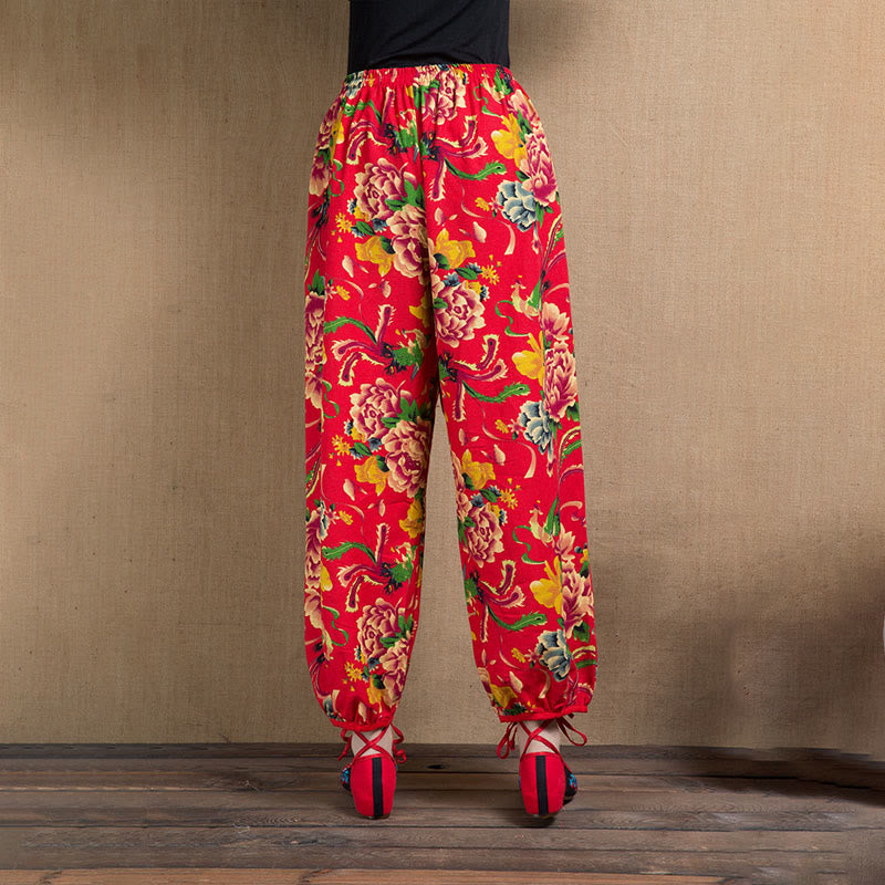 Pantalones harén con estampado de flores rojas y verdes de estilo étnico Mythstone y bolsillos 