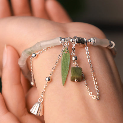 Pulsera con dije de linterna de hoja de bambú y jade blanco natural de plata esterlina 925 de Mythstone