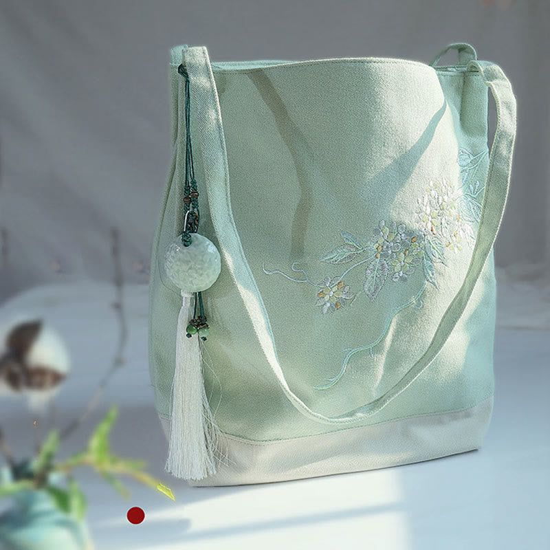 Bolso de mano de lona de gran capacidad con bordado de flores de ciruelo y grulla de Mythstone