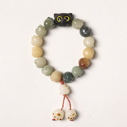 Pulsera de la suerte con forma de gato de la sabiduría y semillas de Bodhi naturales de Mythstone con forma de pata encantadora de madera de ébano 