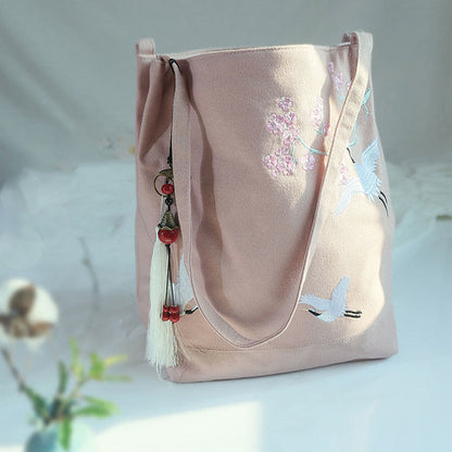 Bolso de mano de lona de gran capacidad con bordado de flores de ciruelo y grulla de Mythstone