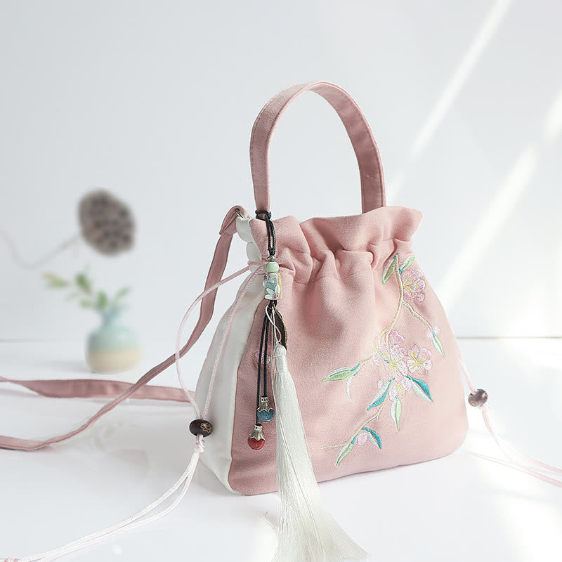 Bolso de mano de lona con flores bordadas a mano de Mythstone