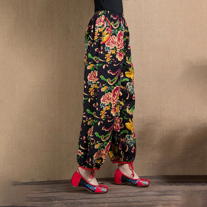 Pantalones harén con estampado de flores rojas y verdes de estilo étnico Mythstone y bolsillos 