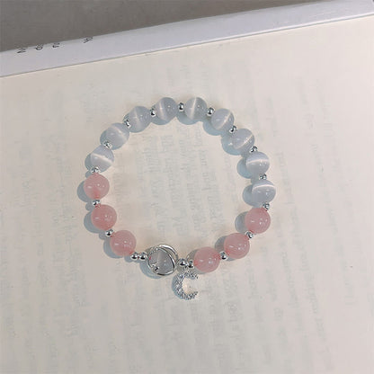 Pulsera con dije de luna y amor de cristal rosa ojo de gato natural de MythStone