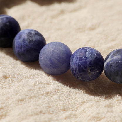 Pulsera de armonía con luna creciente y león danzante de marfil, sodalita y piedra mitológica