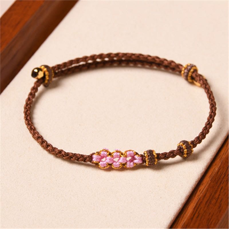 Pulsera trenzada de protección de flor de durazno hecha a mano de Mythstone